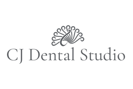 Logo for CJ Dental Studio, in grey text, with a fan-style image at the top