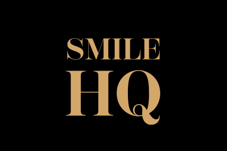 Logo for Smile HQ with gold text on a black background