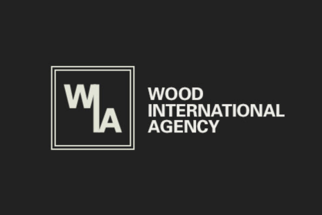 Logo for WOOD INTERNATIONAL AGENCY with white text on a black background and the letters W, I and A together in a white hollow square with an outline.