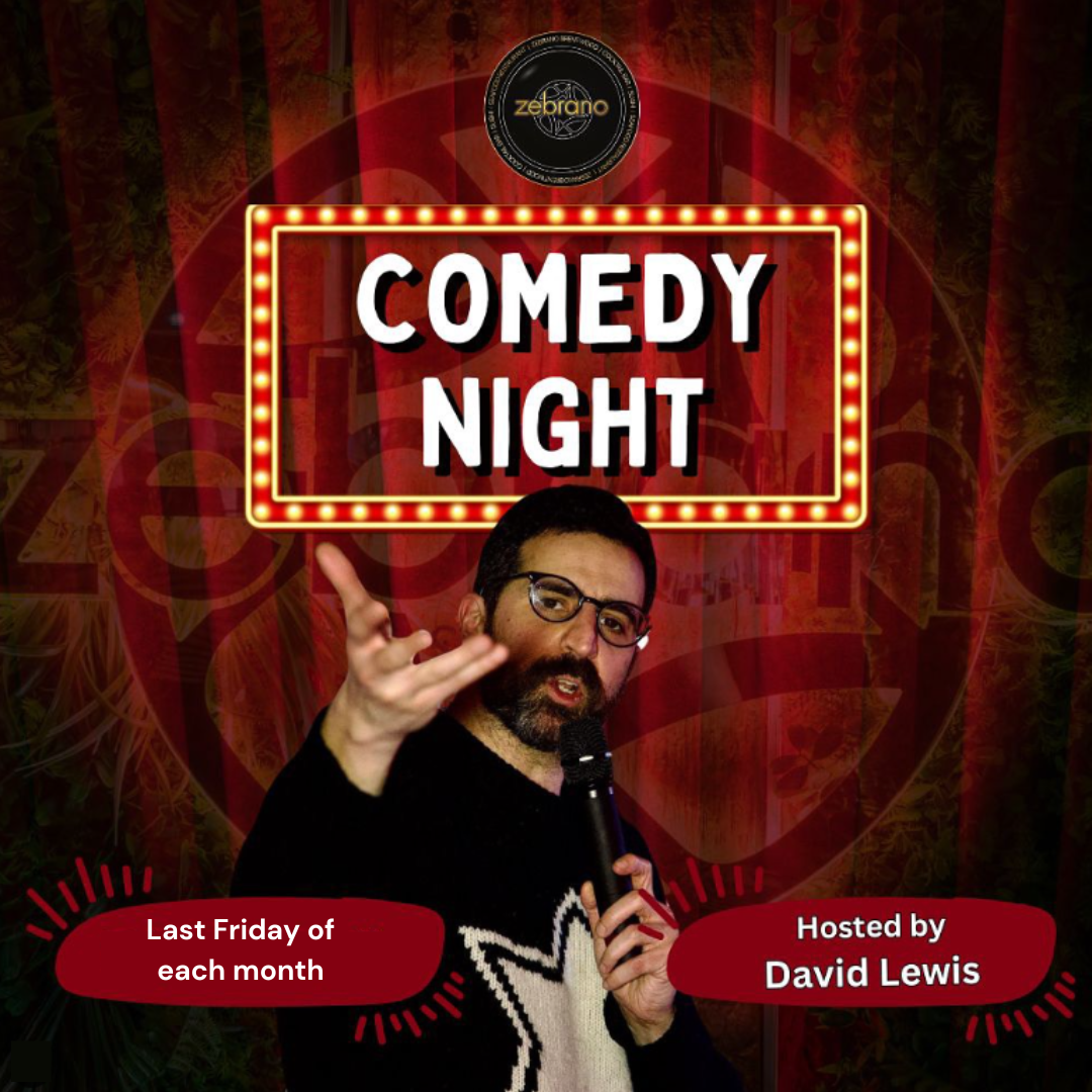 Image of comedian David Lewis holding a mic and pointing towards the camera, with COMEDY NIGHT in text behind, with lit-up surround.  Last Friday of each month.  Hosted by David Lewis.  Zebrano logo