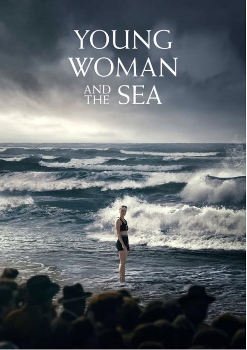 Young Woman And The Sea film poster. A lady standing on some rocks by the sea.