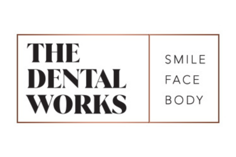 Logo for THE DENTAL WORKS.  Black text on a white background with a gold outline.  The words 'SMILE', 'FACE' and 'BODY' appear to the right.