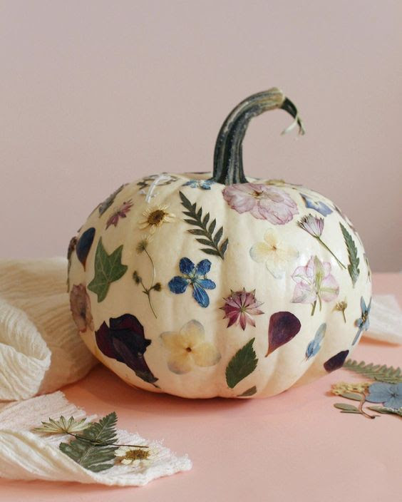 Image showing a pumpkin decoupaged in white with a variety of dried flowers.