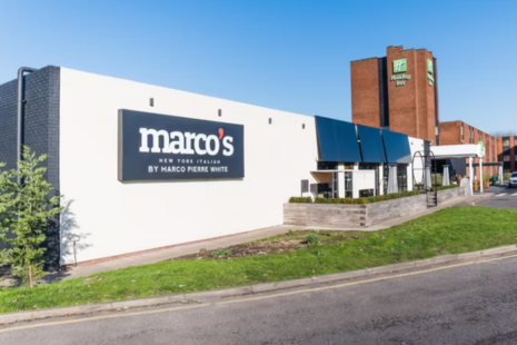 Image showing the exterior of Marco's New York Italian by Marco Pierre White, located at the Holiday Inn Brentwood.  The Holiday Inn signage is visible in the background.