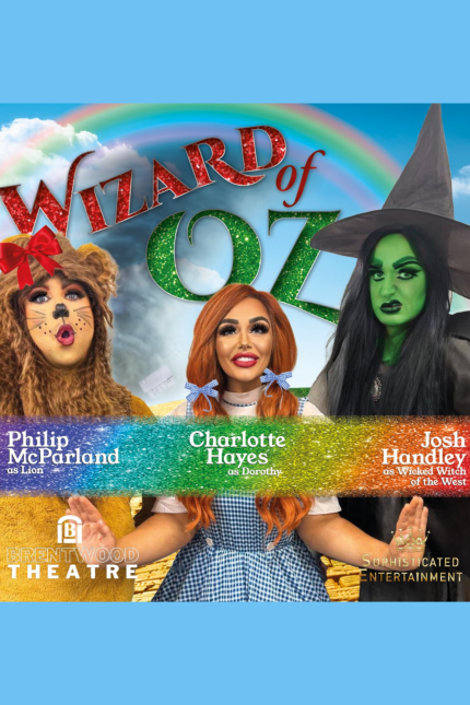 Image showing Phillip McParland, Charlotte Hayes and Josh Handley dressed as the Lion; Dorothy, with red hair tied in bunches and wearing a blue gingham dress; and the Wicked Witch in a witch's hat and green face from The Wizard of Oz.  Wording reads 'WIZARD OF OZ', with a rainbow and Brentwood Theatre and Sophisticated Entertainment logos
