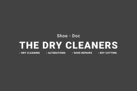 Logo for Shoe-Doc THE DRY CLEANERS with white text on a dark grey background. Underneath are the words 'DRY CLEANING  ALTERATIONS  SHOE REPAIRS  KEY CUTTING' in white.