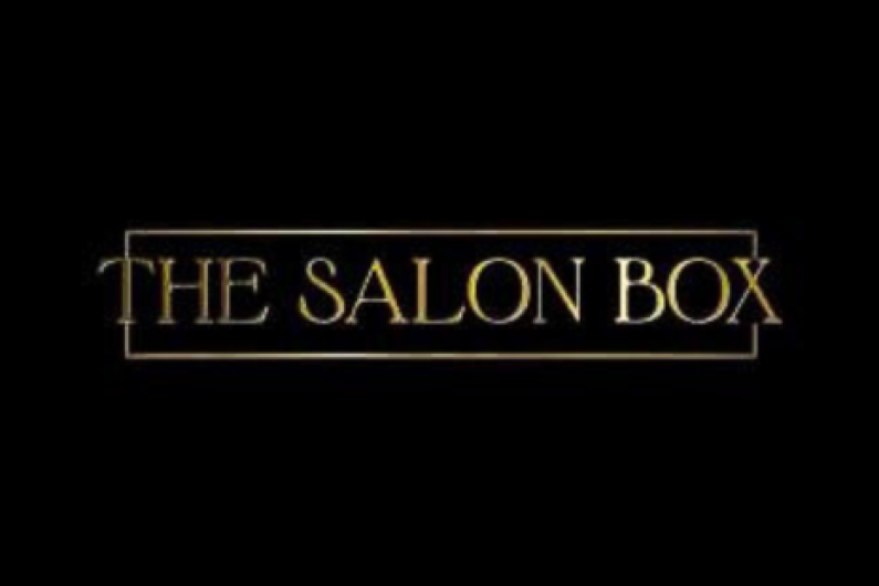 Logo for THE SALON BOX - gold text on a black background, with a gold frame.