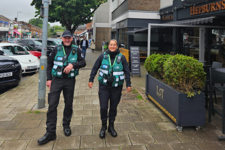 Town Rangers Andrew and Chelsie, wearing green Brentwood Connected tactical vests, walking in Hutton Road, Shenfield