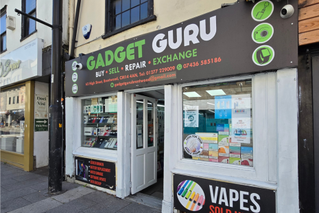 Exterior image of Gadget Guru on Brentwood High Street - the signage explains the business buys, sells, repairs and exchanges gadgets.