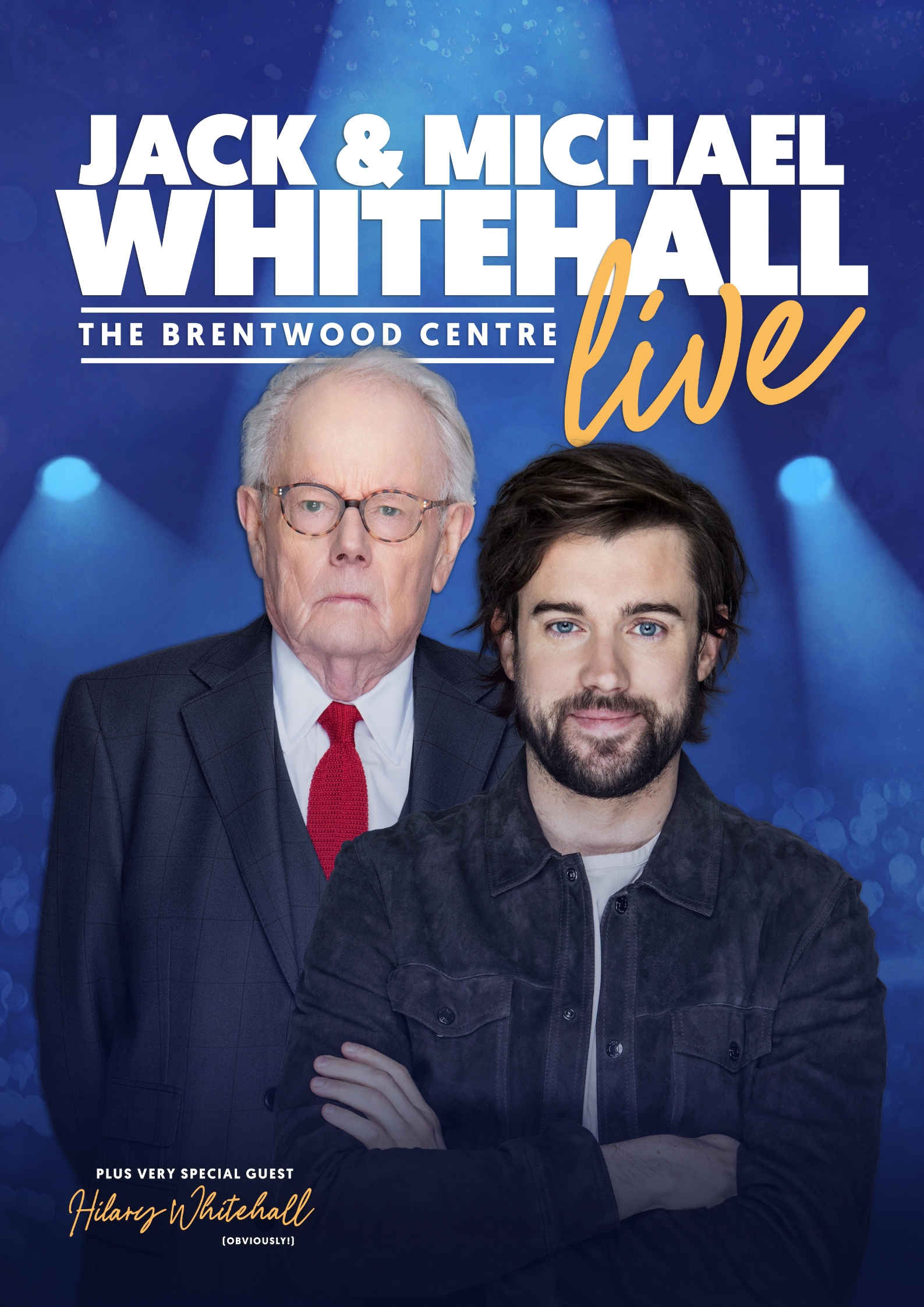 Two men (Jack and Michael Whitehall) standing against a blue stage background.